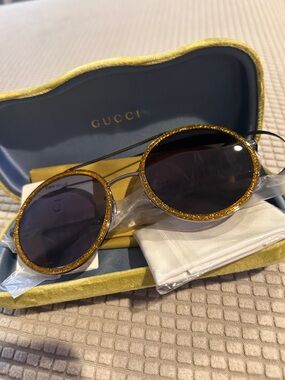 Gucci Round Sunglasses with Gold Glitter Trim and Black Lenses